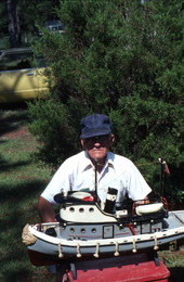 Mack Brown holding a model boat he made - Panama City, Florida.