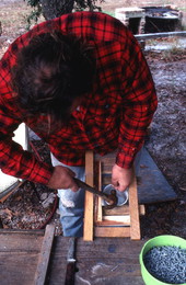 Steve Moody baiting a stone crab trap he made - Perry, Florida