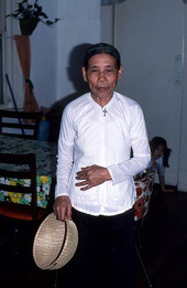 Vietnamese American basket maker Nhang Bui with one of her works- Pensacola, Florida.