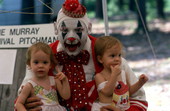 Children sitting with clown Jim Parker - White Springs, Florida