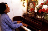 Ida Goodson playing piano at her home - Pensacola, Florida.