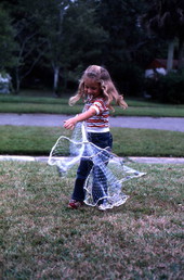 Maria Birchfield's daughter showing how to throw a cast net.