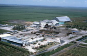 Aerial view of sugar cane fields and farm buildings - Clewiston Region, Florida