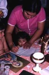 Woman signing papers to have a picture of the Virgin of Fatima in her house - Emporia, Florida