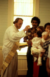 Chuck Bard performing a baptismal ceremony - Seville, Florida