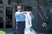 Buddy Maddox holding a net he made - Panama City, Florida.
