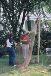 Hurbert Whitworth and an unidentified helper making a fishing net - Pensacola, Florida.