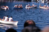 Boys getting ready to dive into water to retrieve an epiphany cross as part of a contest - Tarpon Springs, Florida