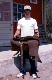 David Cauley holding a saddle he made - Lakeland, Florida
