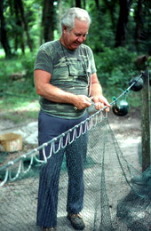 Net maker Martin Cooper repairing a shrimp trawl net - Jacksonville, Florida
