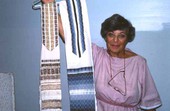 Florette Semigran with examples of Jewish prayer shawls - North Miami Beach, Florida.
