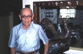 Jacob Sheiniuk with sculpted rooster - North Miami Beach, Florida.