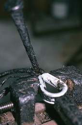 Detail of thimble in vice being spliced into cable - Eastpoint, Florida