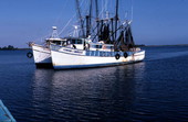 Two shrimp boats, one of which is disabled - Apalachicola, Florida.