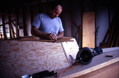 Bobby Shiver works on the cabin of an oyster skiff - Eastpoint, Florida