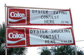 Signs for oyster shucking and eating contests..