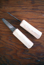 Wooden handle oyster knives made by Loys Cain.