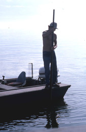 Cletis Anderson using oyster tongs - Apalachicola Bay, Florida.