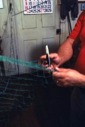 L. Scarabin making a cast net - Apalachicola, Florida