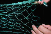 L. Scarabin making a cast net - Apalachicola, Florida