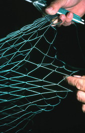 L. Scarabin making a cast net - Apalachicola, Florida