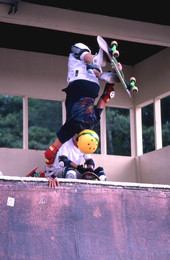 Skateboarder on a half pipe performing aerial moves - Jacksonville, Florida