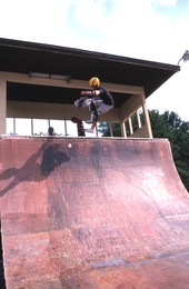 Skateboarder on a half pipe performing aerial moves - Jacksonville, Florida.