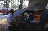 Hiram Jenkins searing ribs over the fire - Jacksonville, Florida