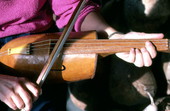 Linda Beth Waldron playing a gourd fiddle she made - White Springs, Florida