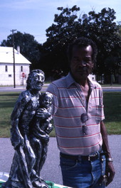 Pharaoh Baker with one of his sculptures - Lake City, Florida