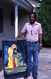 Pharaoh Baker with one of his paintings - Lake City, Florida