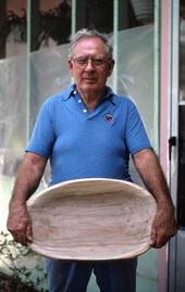 Harlan Baxter holding a basket he made