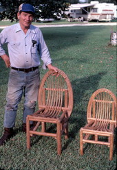 Robert Rudd showing two cypress chairs he made - Lake Worth, Florida.