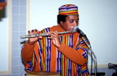 Member of Voice of the Ancestors playing a flute - Jacksonville, Florida