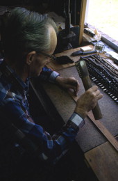 Leather worker Bob Dellis working - Okeechobee, Florida