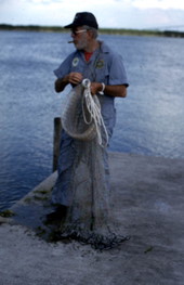 Max Dooley using a cast net he made - Lakeland, Florida