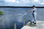 Max Dooley using a cast net he made - Lakeland, Florida