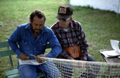 Reginald Reis making a cast net while Max Dooley observes - Lakeland, Florida