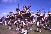 View showing a Scottish pipe band during their performance at the Highland Games in Dunedin, Florida.