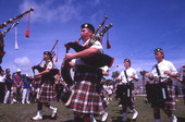 Close-up view showing Scottish pipe band members performing at the Highland Games in Dunedin, Florida.