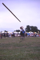 Contestant "turning the caber" during the Highland Games in Dunedin, Florida.