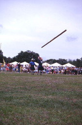 Contest participant "turning the caber" during the Highland Games in Dunedin, Florida.