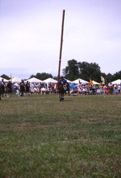 Man in the process of "turning the caber" during the Highland Games in Dunedin, Florida.