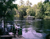 Tour boat "Glendy Burk" in the water as people look on