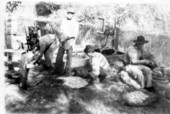 Mikasuki Seminole Indians preparing frog legs at camp on Tamiami Trail