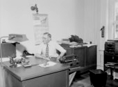 Man sitting at desk in Dept. of State office