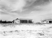 Wood-frame dwelling on beach