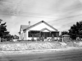 Wood-frame dwelling with screened porch