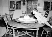 Mary Call Collins blowing candles on her birthday cake