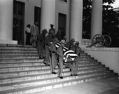 Casket of Dan McCarty carried down steps of Capitol